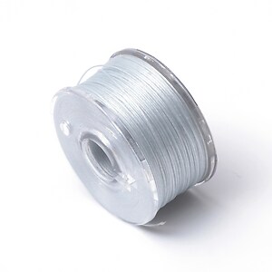 Rola guta elastica japoneza pentru margelele de nisip, grosime 0,1mm, rola aprox. 40m - albastru deschis