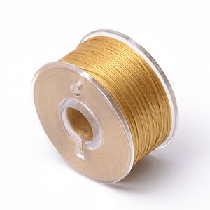 Rola guta elastica japoneza pentru margelele de nisip, grosime 0,1mm, rola aprox. 40m - galben auriu