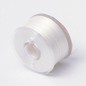 Rola guta elastica japoneza pentru margelele de nisip, grosime 0,1mm, rola aprox. 40m - alb