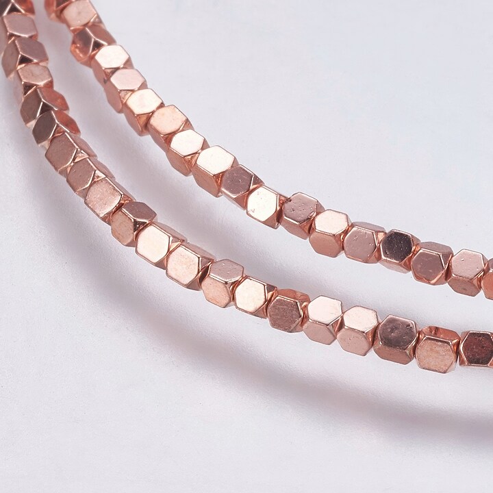 Hematit cub 1,5x1,5x1,5mm - placat rose gold (sirag)