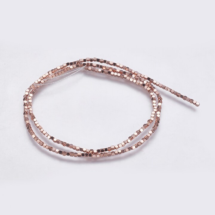 Hematit cub 1,5x1,5x1,5mm - placat rose gold (sirag)